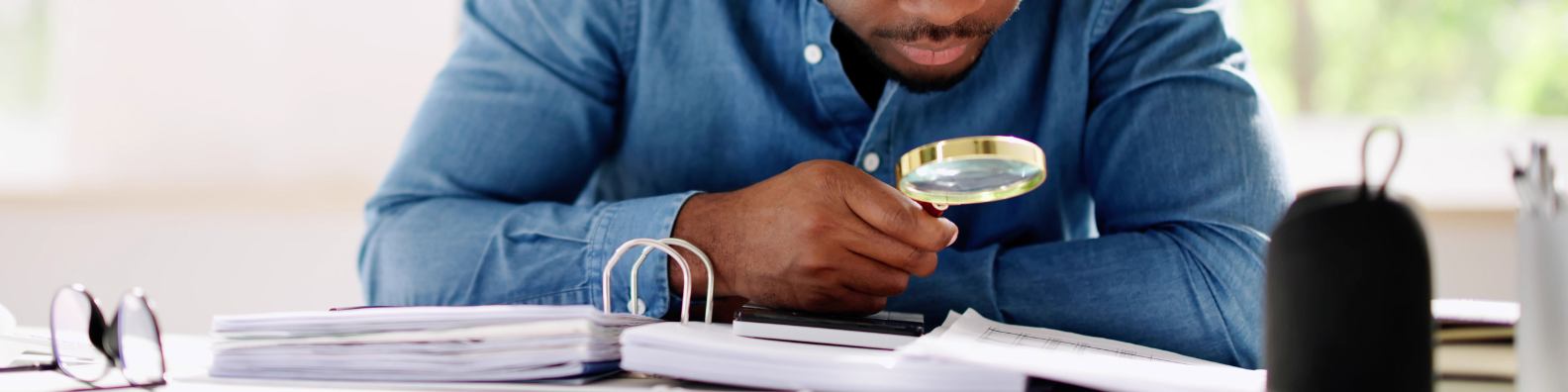 Attorney reviewing IRS Offer in Compromise documents with a taxpayer